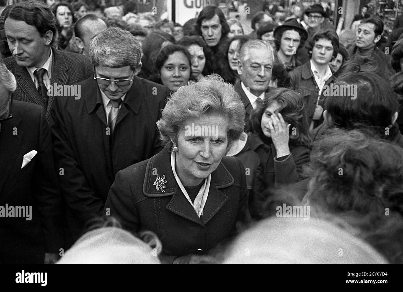 AJAXNETPHOTO.11TH FEBRUARY,1977. PORTSMOUTH, ENGLAND.  - CITY WALKABOUT - MRS MARGARET THATCHER (CON), LEADER OF THE OPPOSITION, ENGAGES WITH THE PUBLIC IN COMMERCIAL ROAD SHOPPING PRECINCT DURING A CAMPAIGN WALKABOUT. PHOTO:JONATHAN EASTLAND/AJAX REF:3771102 48 Stock Photo