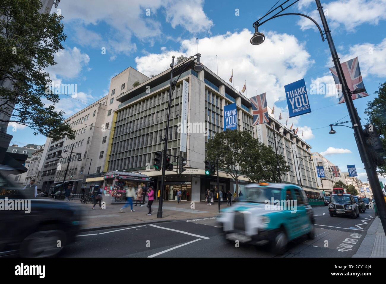 London, UK.  1 October 2020.  Traffic passes John Lewis flagship department store on Oxford Street, traditionally the busiest shopping street in the country.  As a result of the coronavirus pandemic, footfall has declined considerably.  Shoppers are preferring to shop online as people work from home.  Credit: Stephen Chung / Alamy Live News Stock Photo