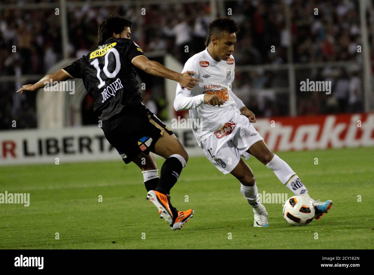 Cristobal Jorquera L Of Chile S Colo Colo Fights For The Ball With Neimar Of Brazil S Santos Fc During Their Copa Libertadores Soccer Match In Santiago March 16 2011 Reuters Ivan Alvarado Chile