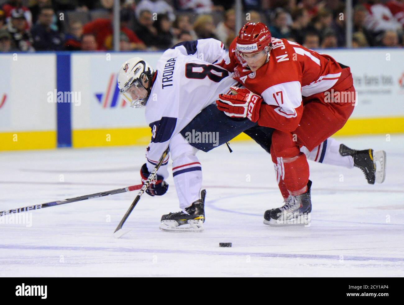 Team USA's Jacob Trouba and Denmark's Nicklas Jensen battle for the puck  during the first period of play at the 2012 IIHF U20 World Junior Hockey  Championship in Edmonton, Alberta, December 26,