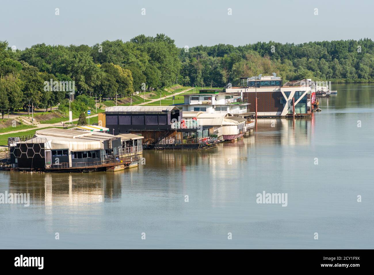 Belgrade / Serbia - June 22, 2019: River barges floating at the confluence of rivers Sava and Danube in Belgrade, Serbia. River barges (splav) are pop Stock Photo