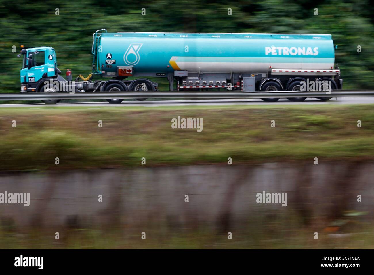 A Petronas Tanker Truck Drives On A Road In Kuala Lumpur September 10 2013 Malaysian Oil Company Petronas Said It Is Exiting One Of The Biggest Petroleum Projects In Venezuela S Orinoco Belt