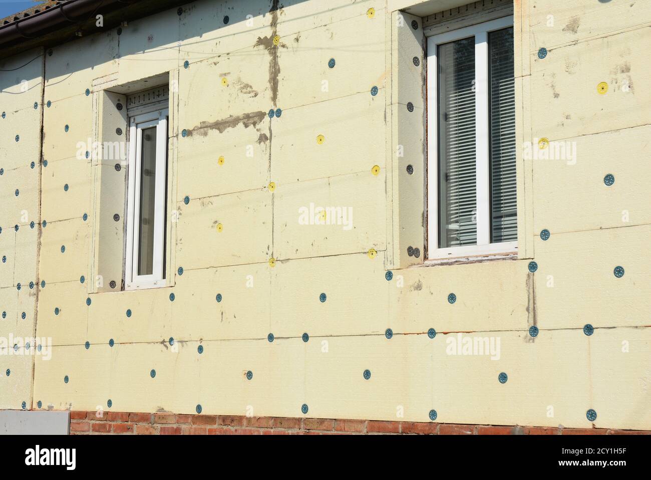 House wall insulation. Unfinished house with styrofoam insulation