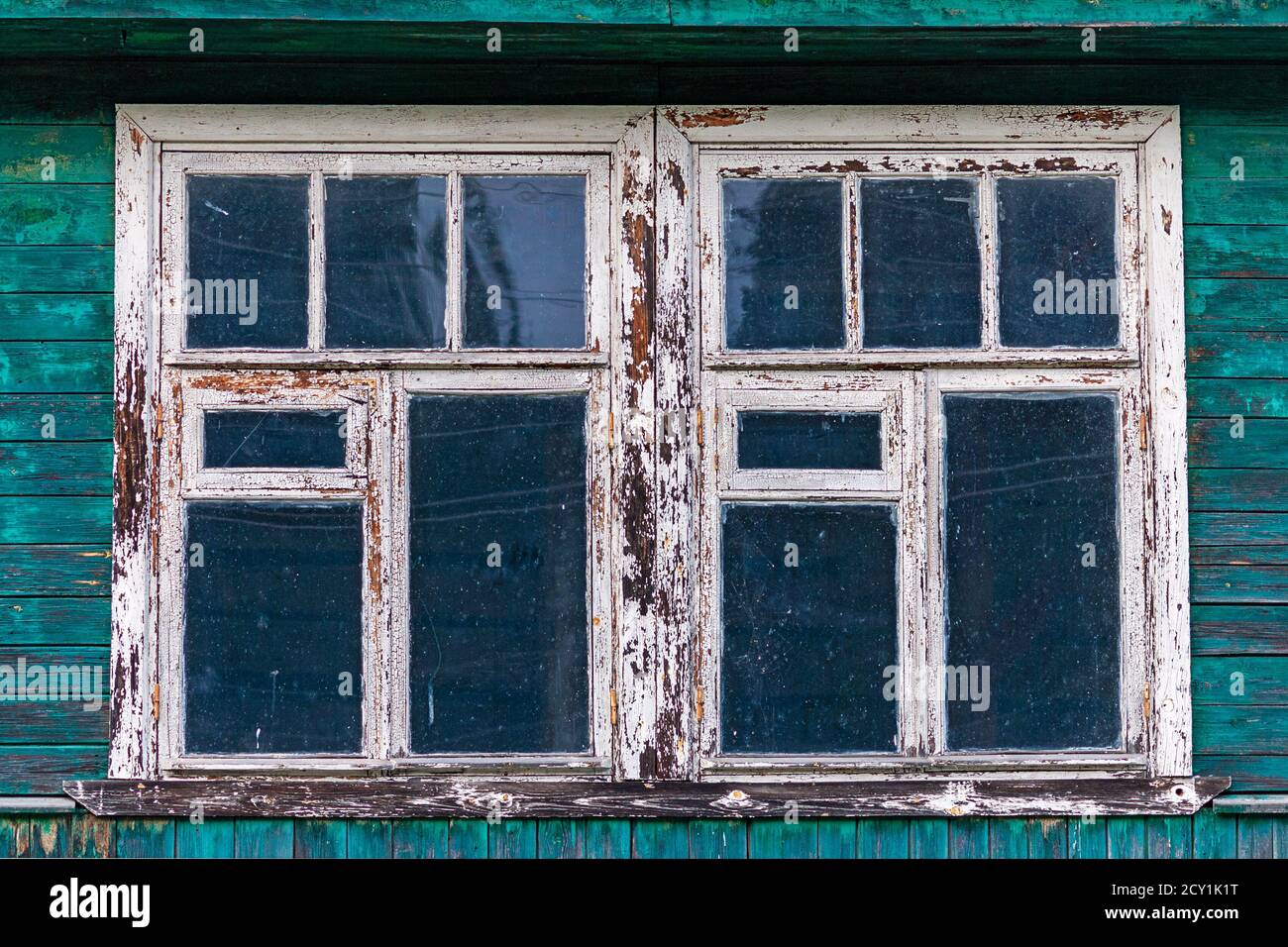 windows of old shabby wooden house Stock Photo