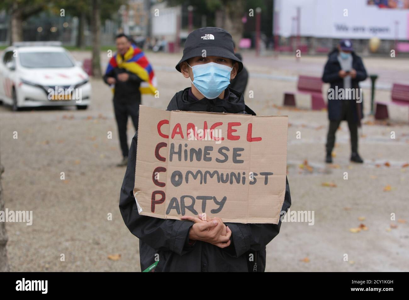 Amsterdam, Netherlands. 01st Oct, 2020. An activists Pro-Democracy in Chine hold a placar with sign Çancel Chinese Communist Party' during protest at the Museumplein amid the Coronavirus pandemic on October 1, 2020 in Amsterdam, Netherlands. Activists and supporters Pro-Democracy protest against human rights violations in Chine, Hong Kong and Tibet demand the end of state violence against people. (Photo by Paulo Amorim/Sipa USA) Credit: Sipa USA/Alamy Live News Stock Photo