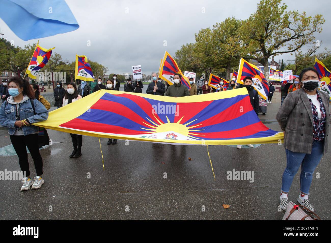 Amsterdam, Netherlands. 01st Oct, 2020. Activists Pro-Democracy in Chine take part during protest hold a national Tibet flag at the Museumplein amid the Coronavirus pandemic on October 1, 2020 in Amsterdam, Netherlands. Activists and supporters Pro-Democracy protest against human rights violations in Chine, Hong Kong and Tibet demand the end of state violence against people. (Photo by Paulo Amorim/Sipa USA) Credit: Sipa USA/Alamy Live News Stock Photo