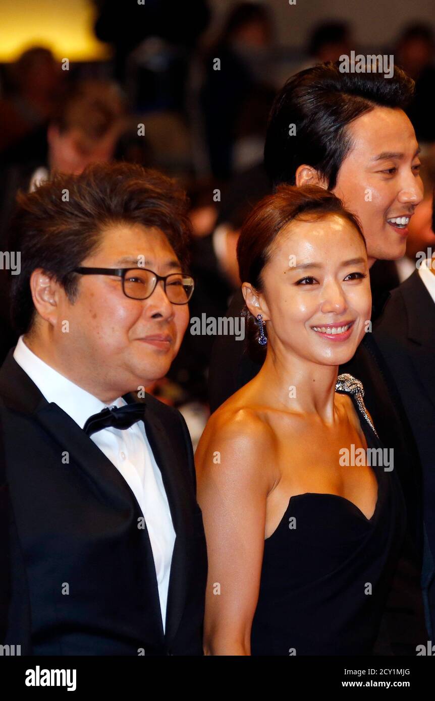 Director Oh Seung Uk L Actress Jeon Do Yeon C And Actor Kim Nam Gil R Pose On The Red Carpet As They Arrive For The Screening Of The Film Mu Roe Han The Shameless In Competition