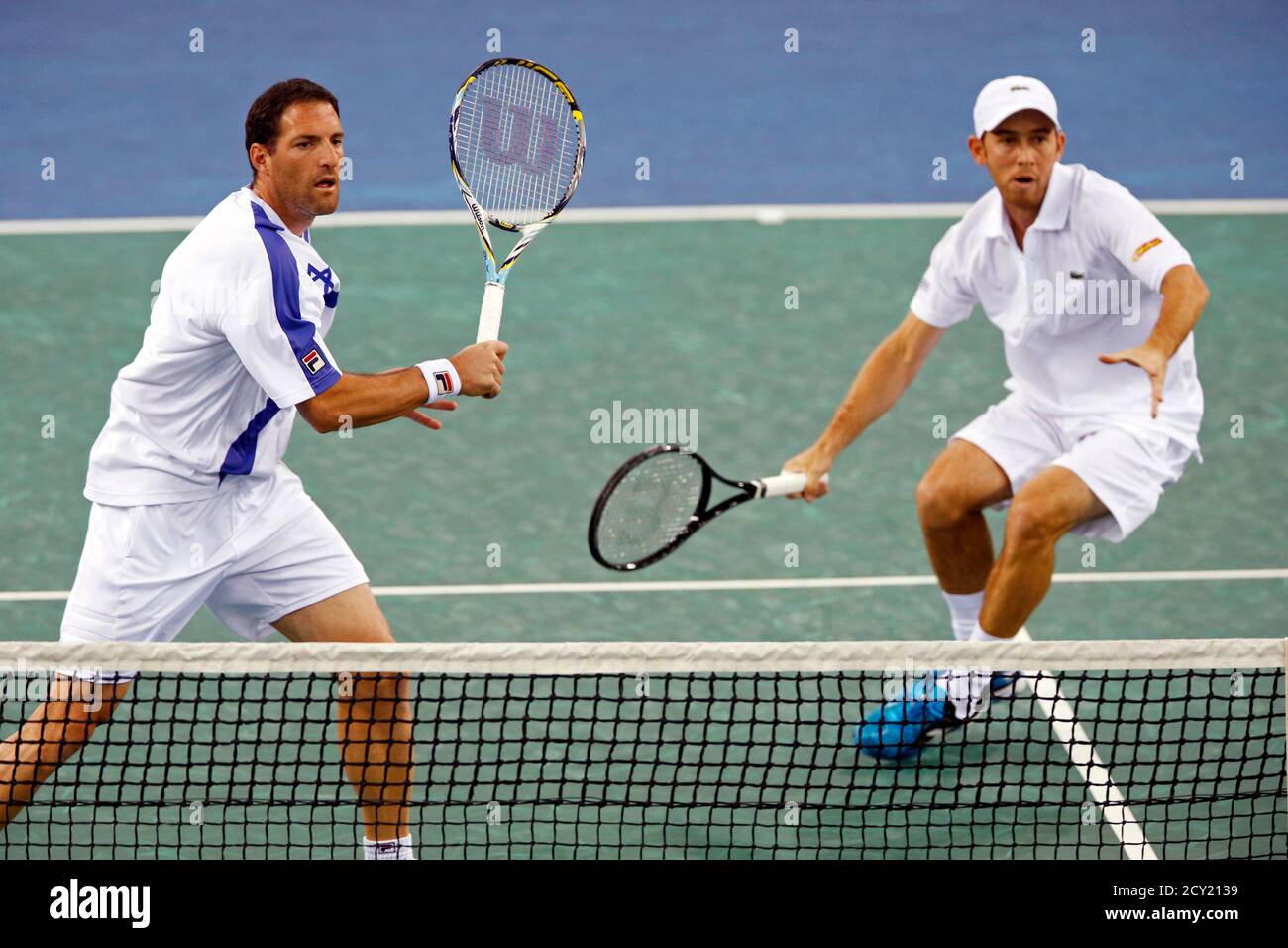 Jonathan Erlich (L) and Dudi Sela (R) of Israel play against Michael Llodra  and Julien Benneteau of France in their men's doubles first round Davis Cup  tennis match in Rouen, February 2,