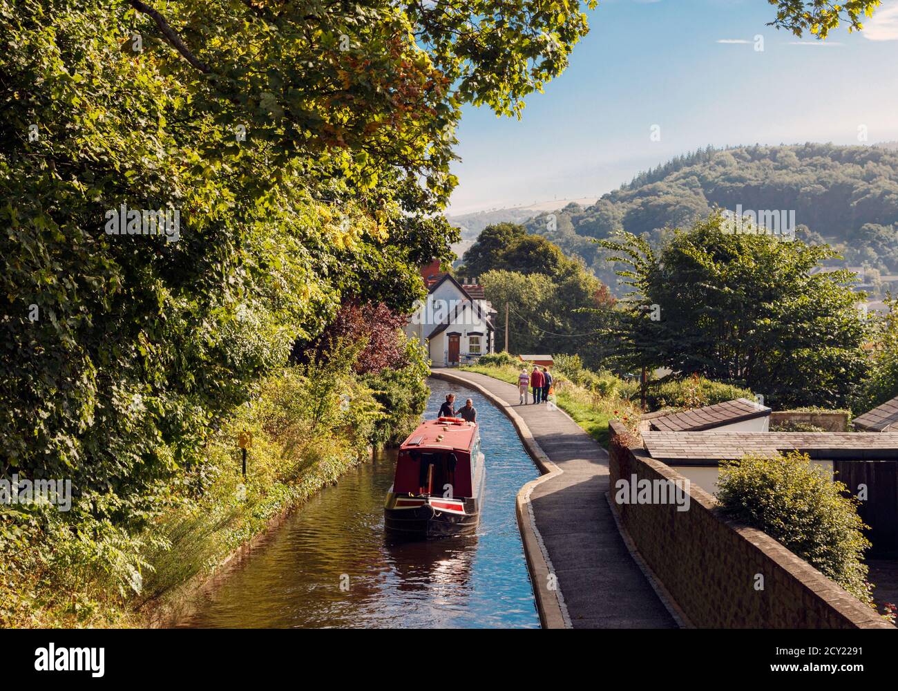 Llangollen, Denbighshire, Wales, United Kingdom.  Boats on the Llangollen canal.  These craft, known as narrowboats, were designed specifically for th Stock Photo