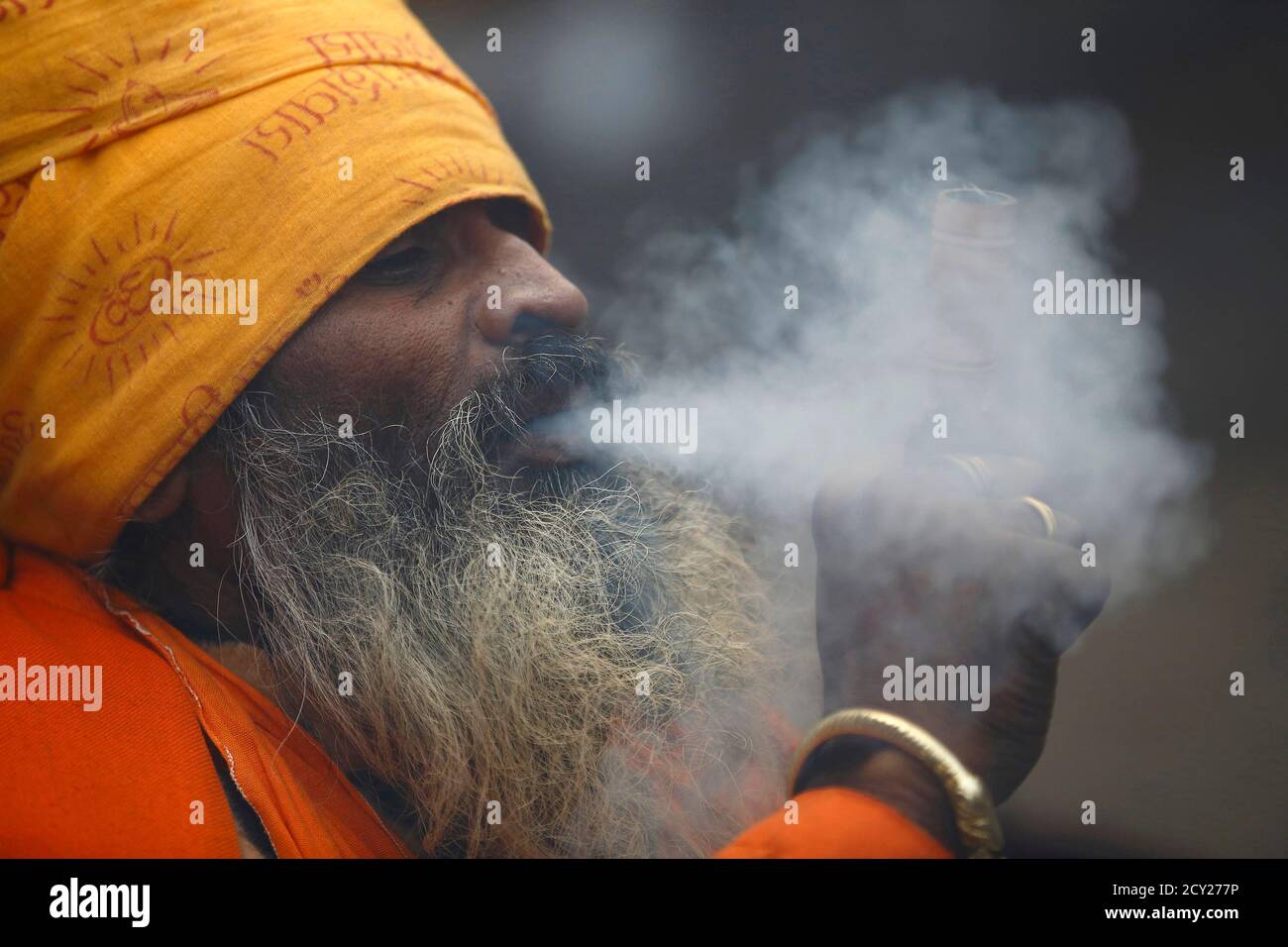 A Hindu Holy Man Or Sadhu Smokes Marijuana In A Chillum On The Premises Of Pashupatinath Temple In Kathmandu February 17 2015 Hindu Holy Men From Nepal And India Come To This