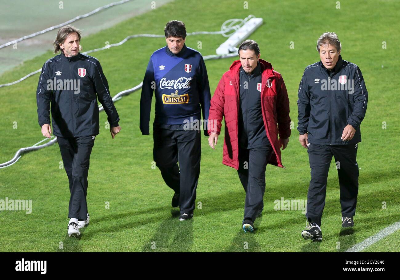 Peru's national team soccer coach Ricardo Gareca (L) walks next to his  assistants during a training session in Valparaiso City, June 17, 2015. Peru  will play in Group C against Venezuela on