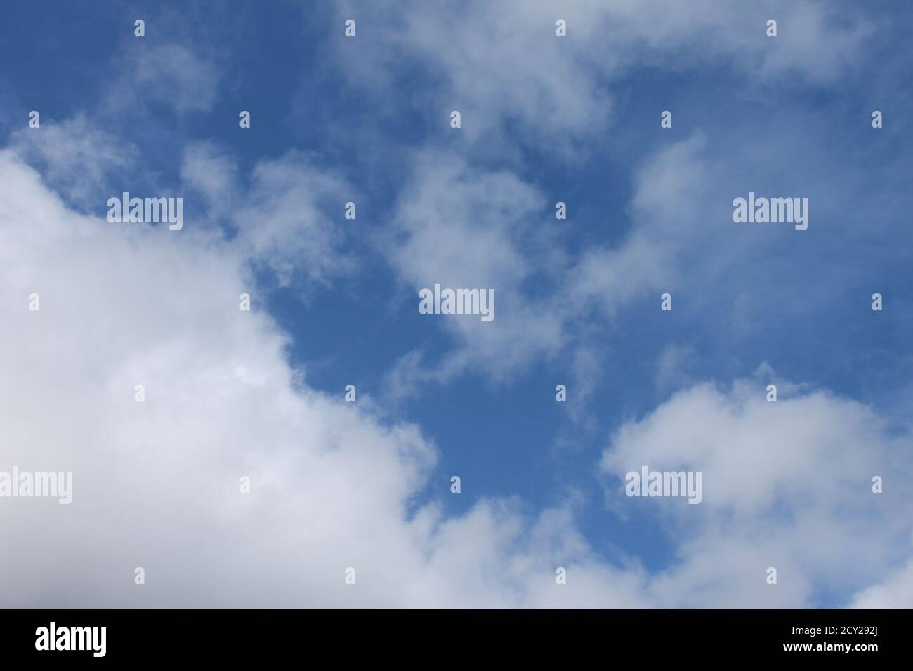 Blue sky with puffy clouds Stock Photo