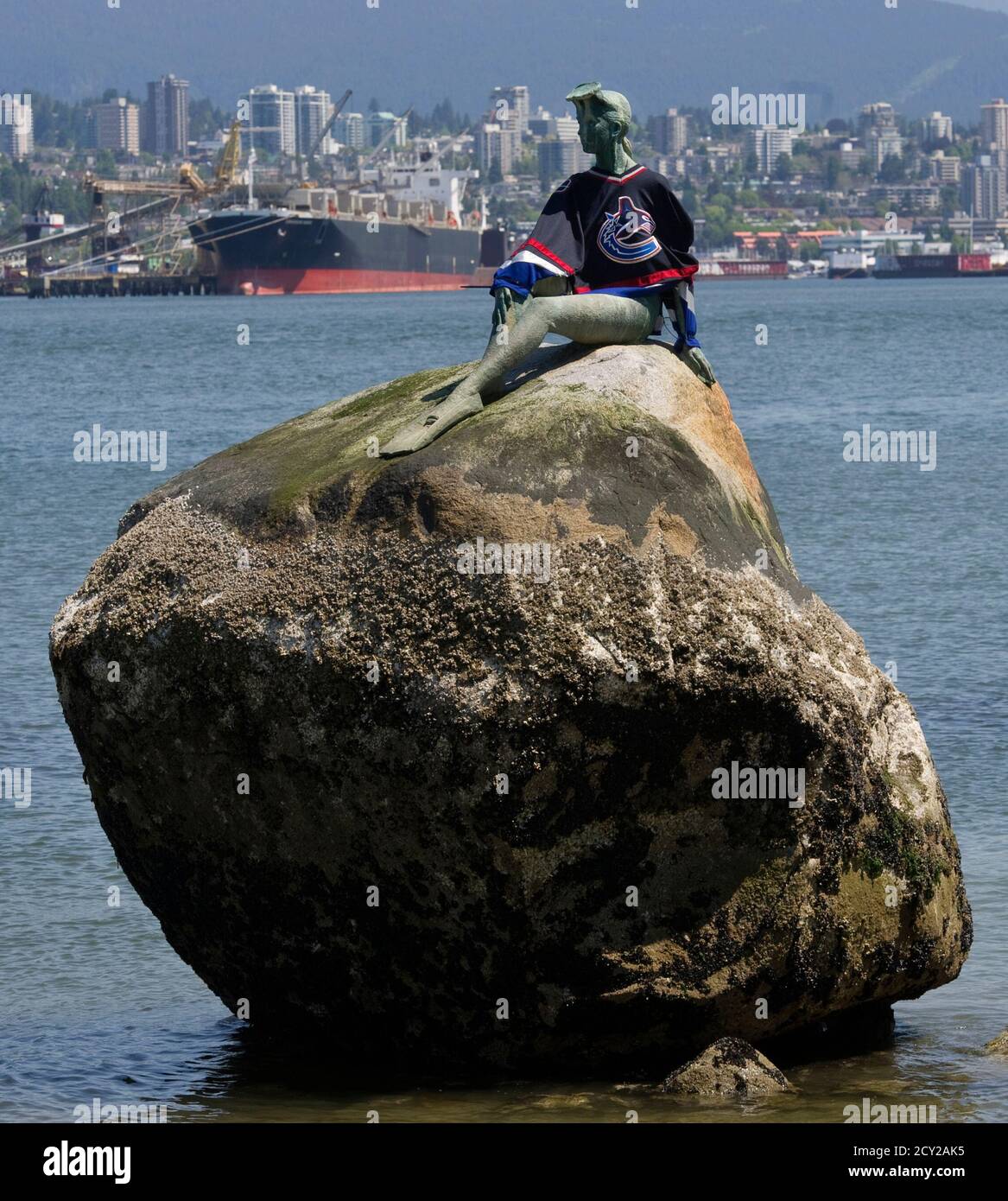 A statue known as Girl in Wetsuit is decked with an NHL Vancouver Canucks  jersey on the waterfront of Vancouver, British Columbia June 6, 2011. The  Canucks and Boston Bruins are facing