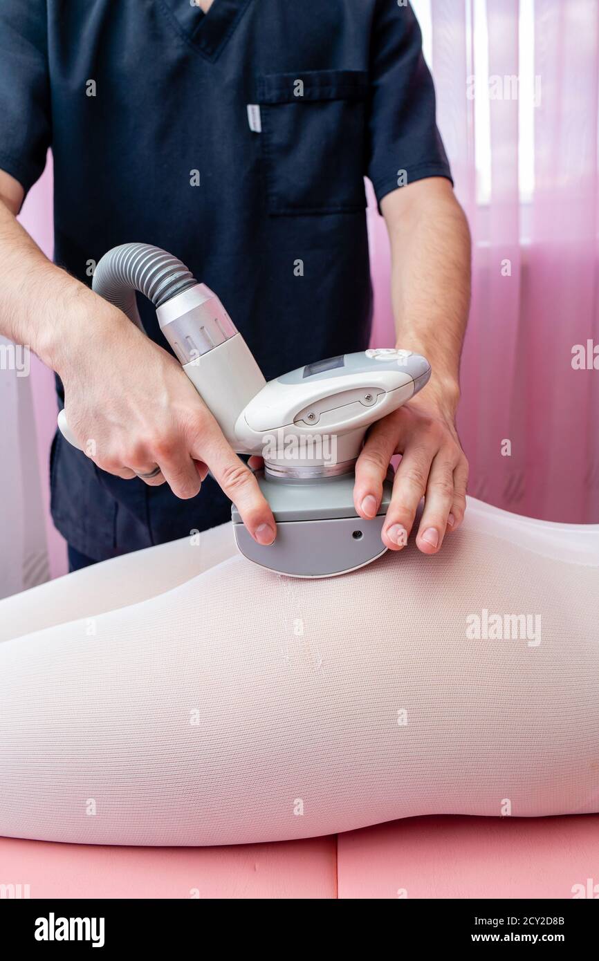 Lpg massage procedure. Hands of therapist holding lipomassage tool. Close up Stock Photo Alamy