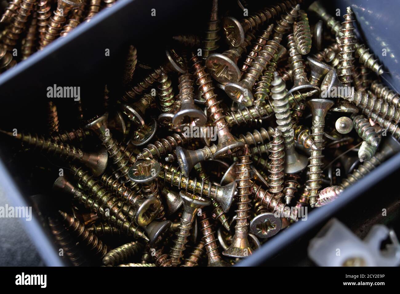 Various screws in plastic box close up Stock Photo Alamy