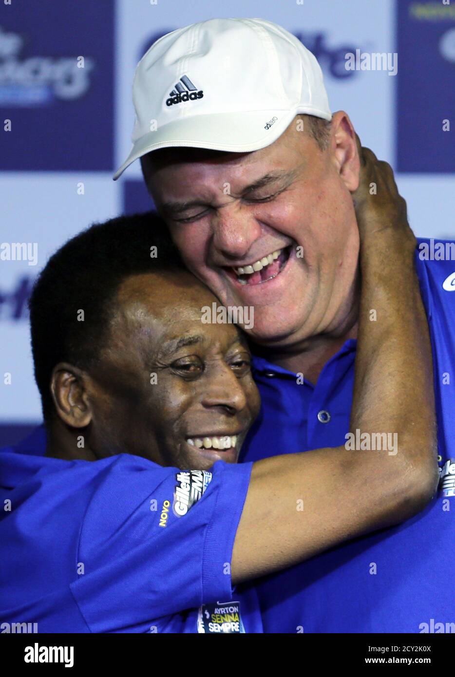 Brazilian soccer legend Pele (L) embraces former Brazilian basketball  player Oscar Schmidt during a promotional event in tribute to late  Brazilian Formula One driver Ayrton Senna in Sao Paulo November 4, 2013.