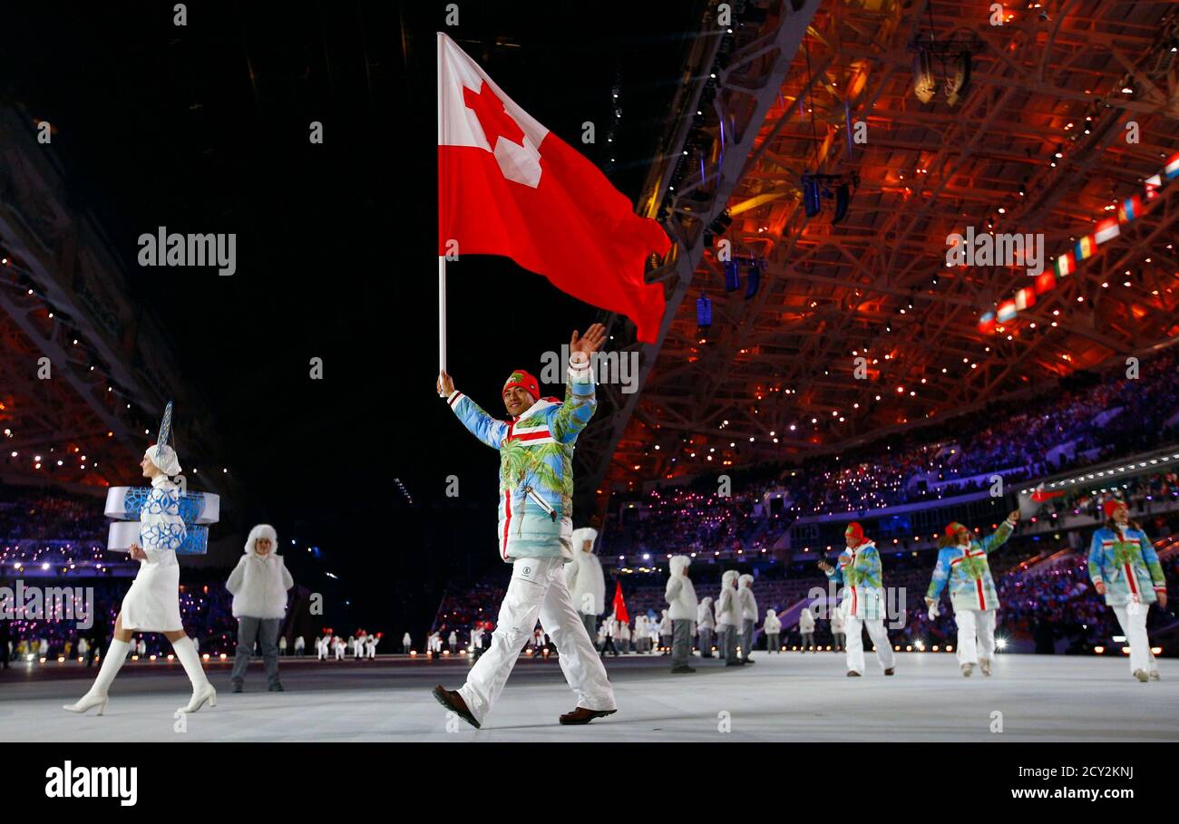 last Zakenman teleurstellen Tonga's flag-bearer Bruno Banani waves as he leads his country's contingent  during the opening ceremony of the 2014 Sochi Winter Olympic Games February  7, 2014. REUTERS/Brian Snyder (RUSSIA - Tags: SPORT OLYMPICS