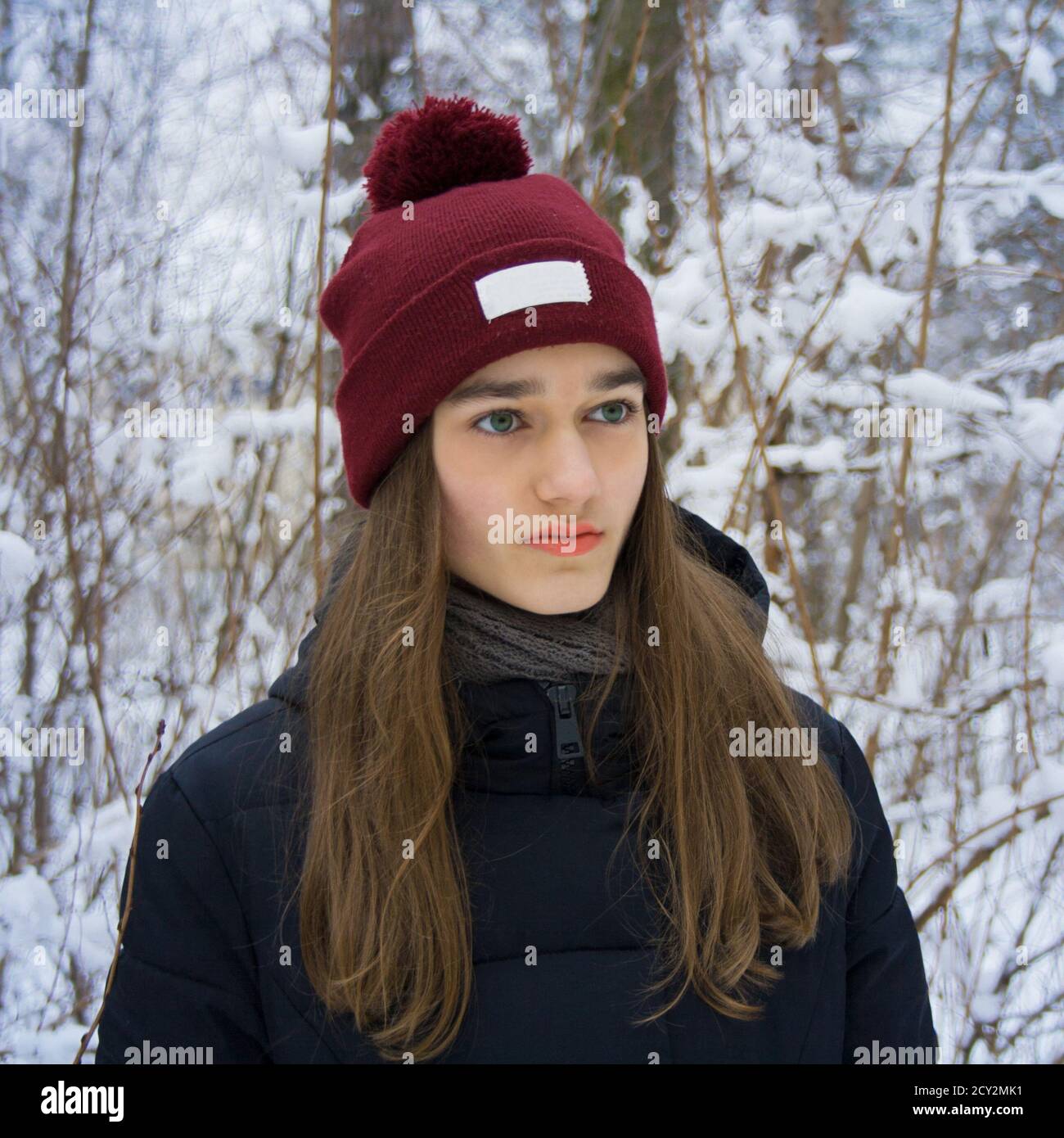 Winter portrait of serious cute beautiful attractive young teen girl ...