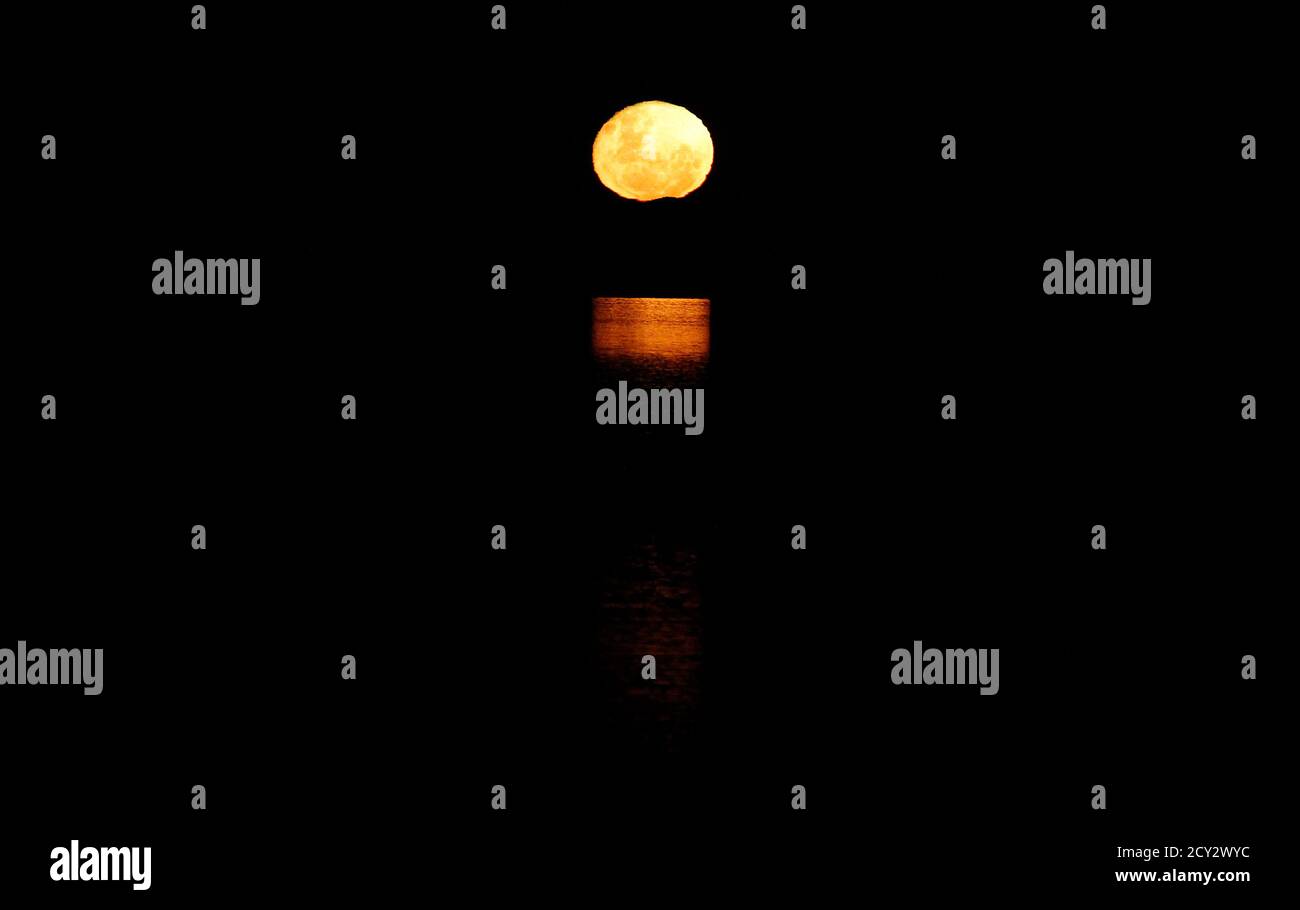 The Full Moon Is Reflected On The Low Tide At Hearson S Cove In Burrup At The