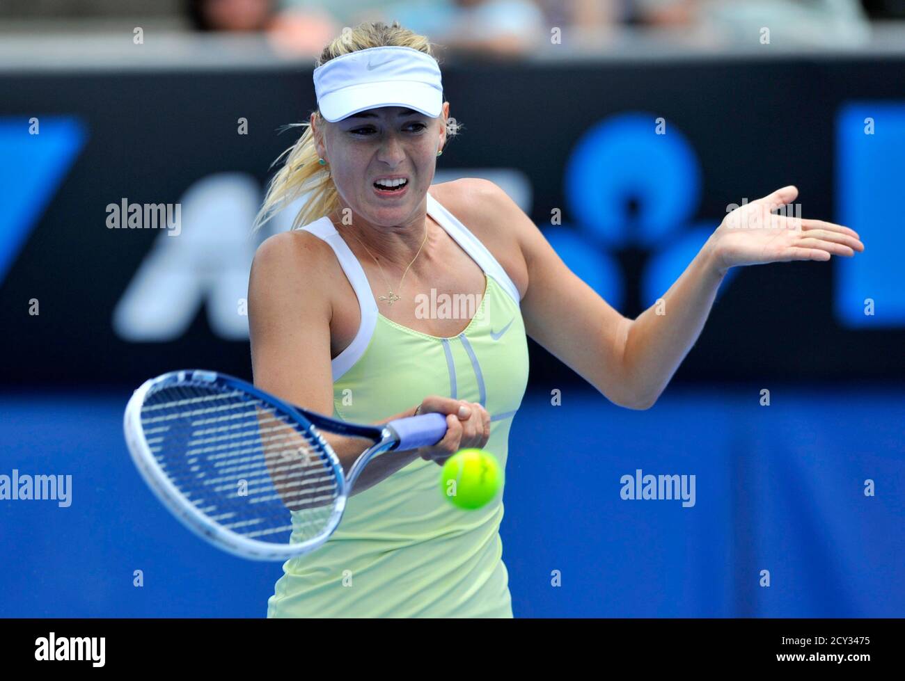 Maria Sharapova of Russia hits a return to Daniela Hantuchova of Slovakia  during an exhibition match at the Australian Open tennis tournament in  Melbourne January 12, 2013. REUTERS/Toby Melville (AUSTRALIA - Tags: