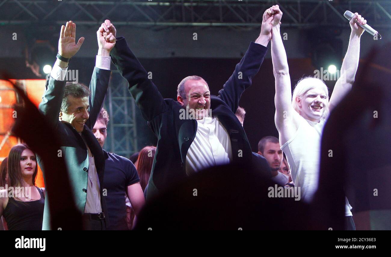 Georgy Margvelashvili C Presidential Candidate From The Ruling Georgian Dream Coalition Georgia S Prime Minister Bidzina Ivanishvili L And His Son Musician Bera Ivanishvili Greet An Audience During A Pre Election Concert In Tbilisi