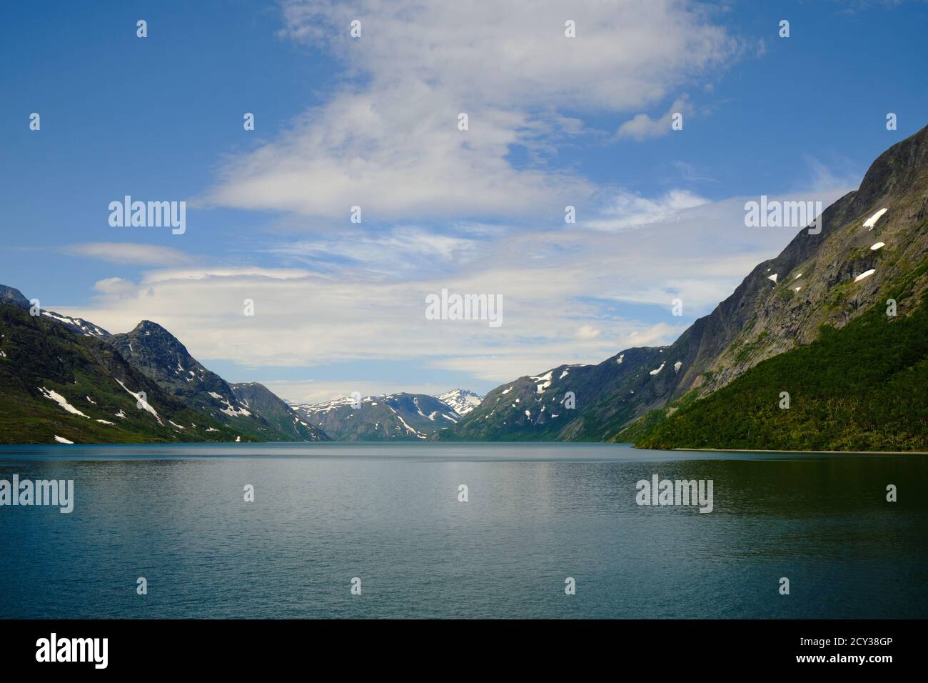 View with snow-covered mountain peaks on the Gjendefjord from a boat Stock Photo