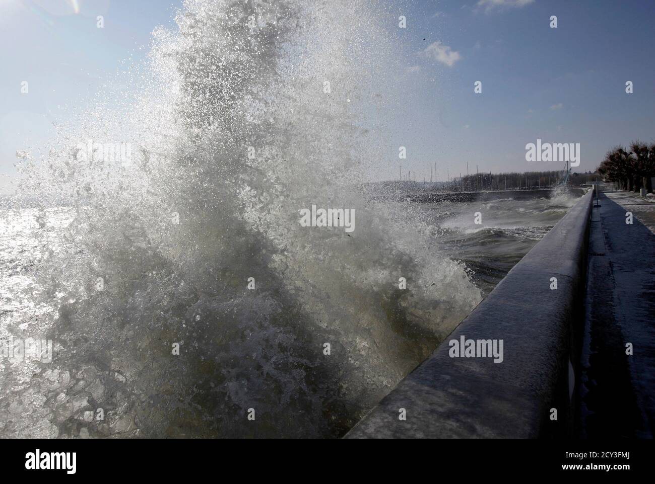 A wave splashes onto a wall on a windy winter day in Grandson, near Yverdon  February 4, 2012. Temperatures dropped to as low as minus 11 degrees  Celsius (12.2 degrees Fahrenheit) in