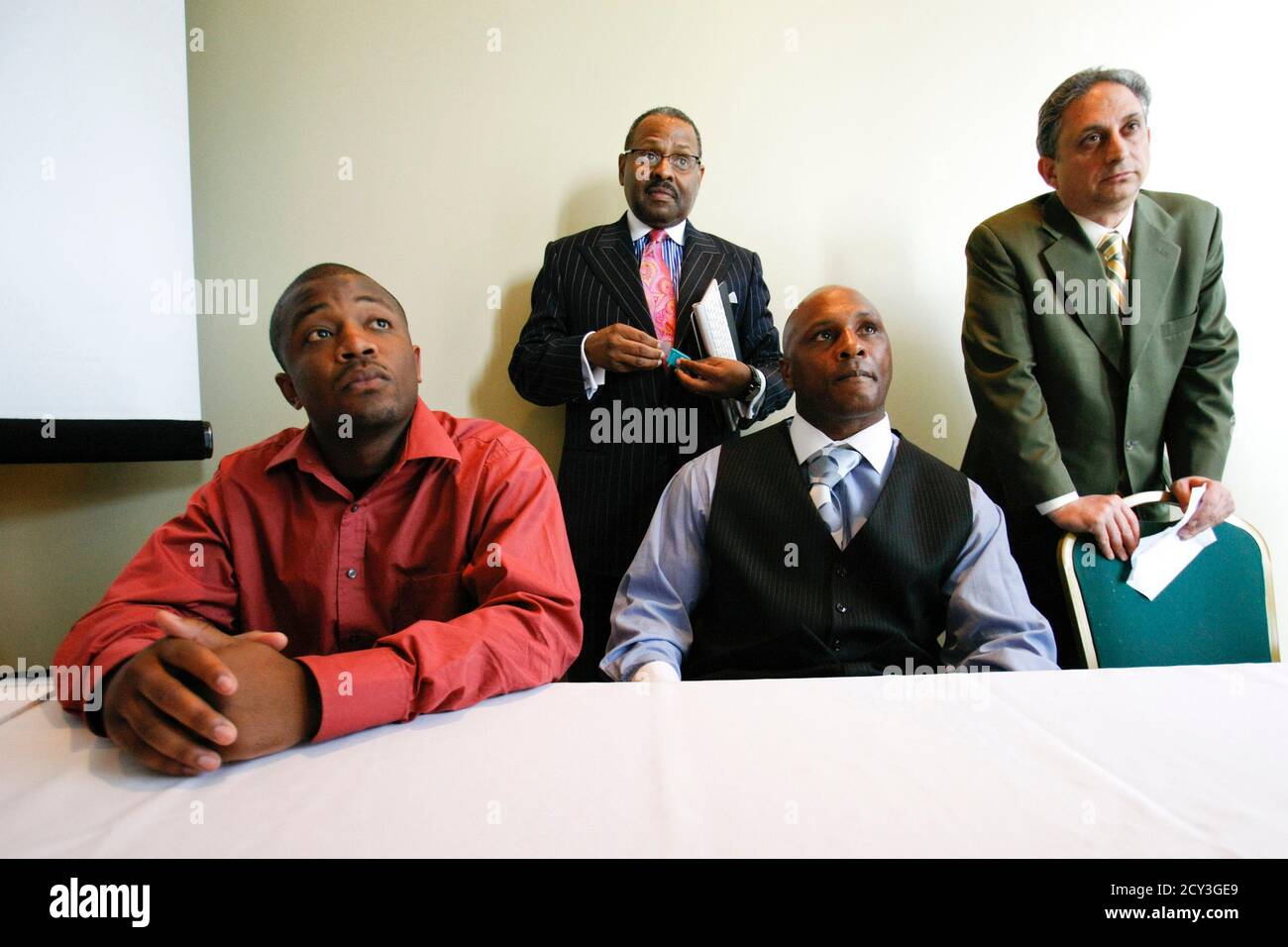Front L To R Christopher Johnson And Nathaniel Claybrooks Talk To The Media With Their Co Counsels Back L To R Byron Perkins And George Barrett During A News Conference To Discuss Their