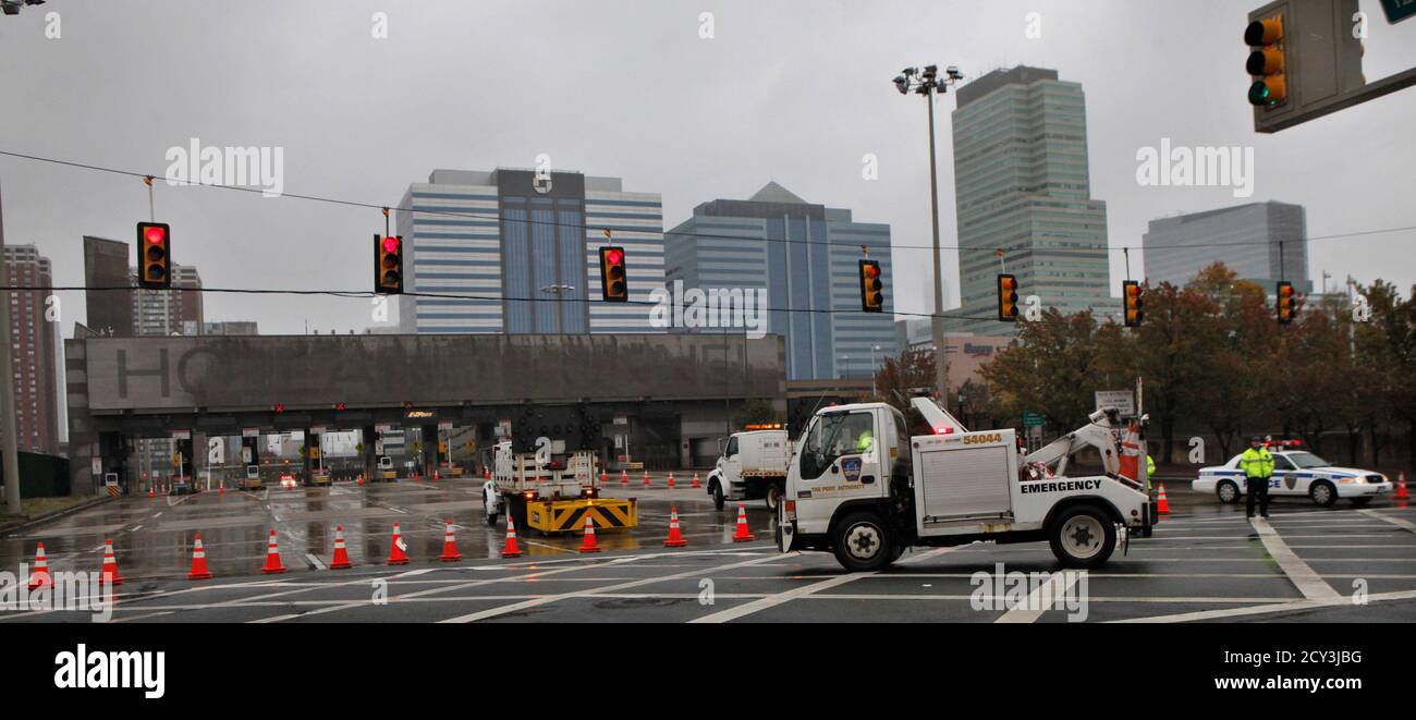 Police officers patrol the Holland Tunnel after being ...
