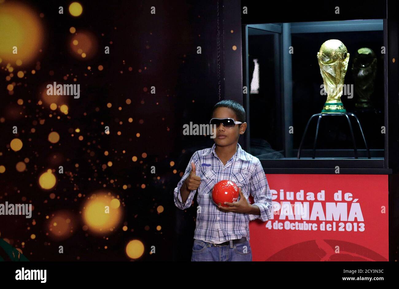 A Boy Poses Next To The Fifa World Cup Trophy In Panama City October 4 13 According To The Organizers The Trophy Will Be On Display In Panama For Two Days As