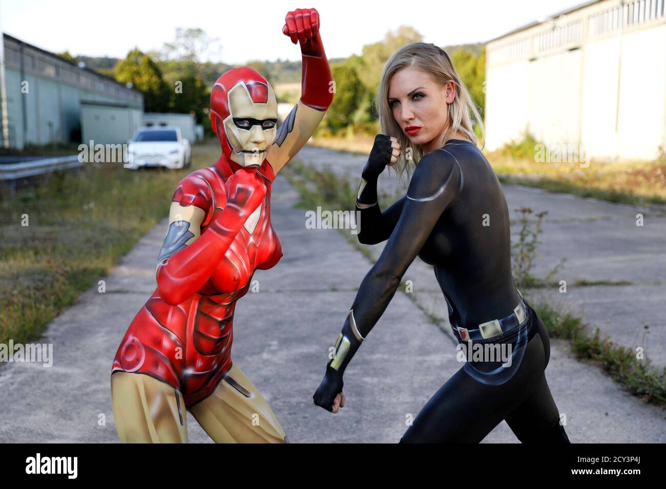 GEEK ART - Bodypainting and Transformaking: Iron Woman and Black Widow photoshooting with René-Claire Meinkold and Karo Zett at the elektroma site in Hamelin on September 30, 2020 - A project by the photographer Tschiponnique Skupin and the bodypainter Enrico Lein Stock Photo
