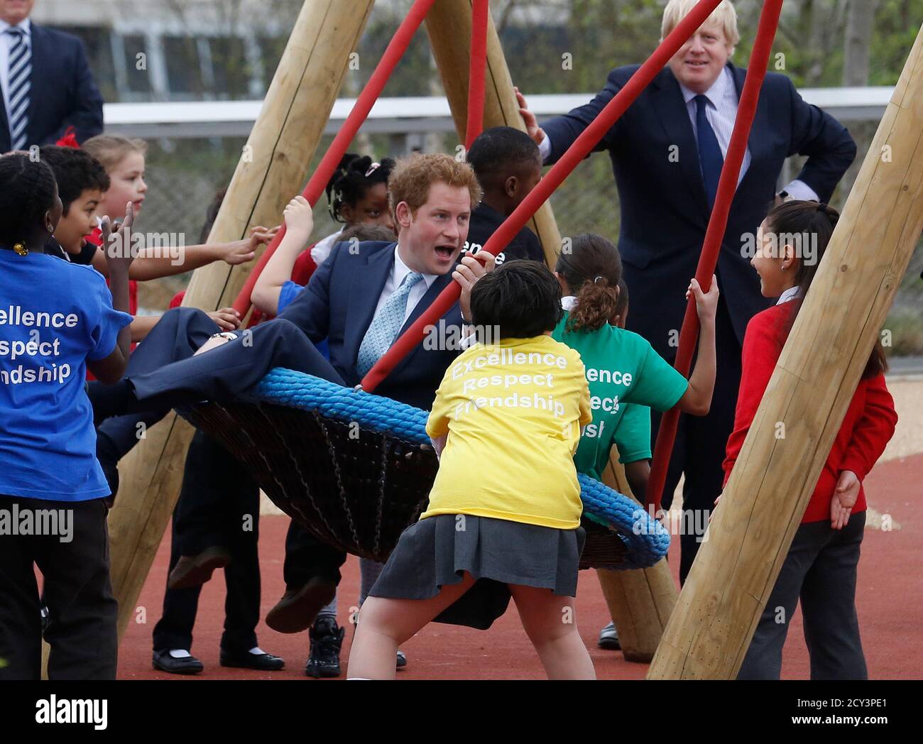 Britain S Prince Harry Plays On A Swing With Children As He And Mayor Of London Boris Johnson R Viewed The Queen Elizabeth Olympic Park Ahead Of Its Opening On Saturday At Stratford