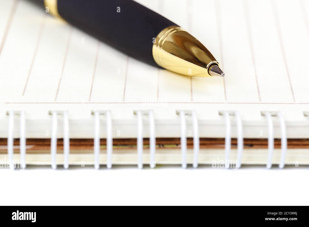 Automatic ballpoint pen and notepad isolated on white background. Stock Photo