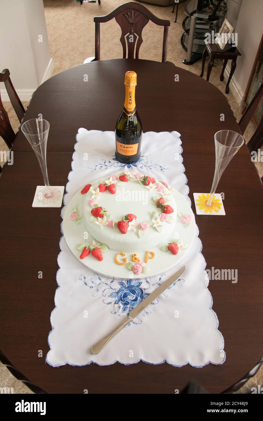 Joint birthday cake with initials G & P, iced with summer fruits and flowers Stock Photo
