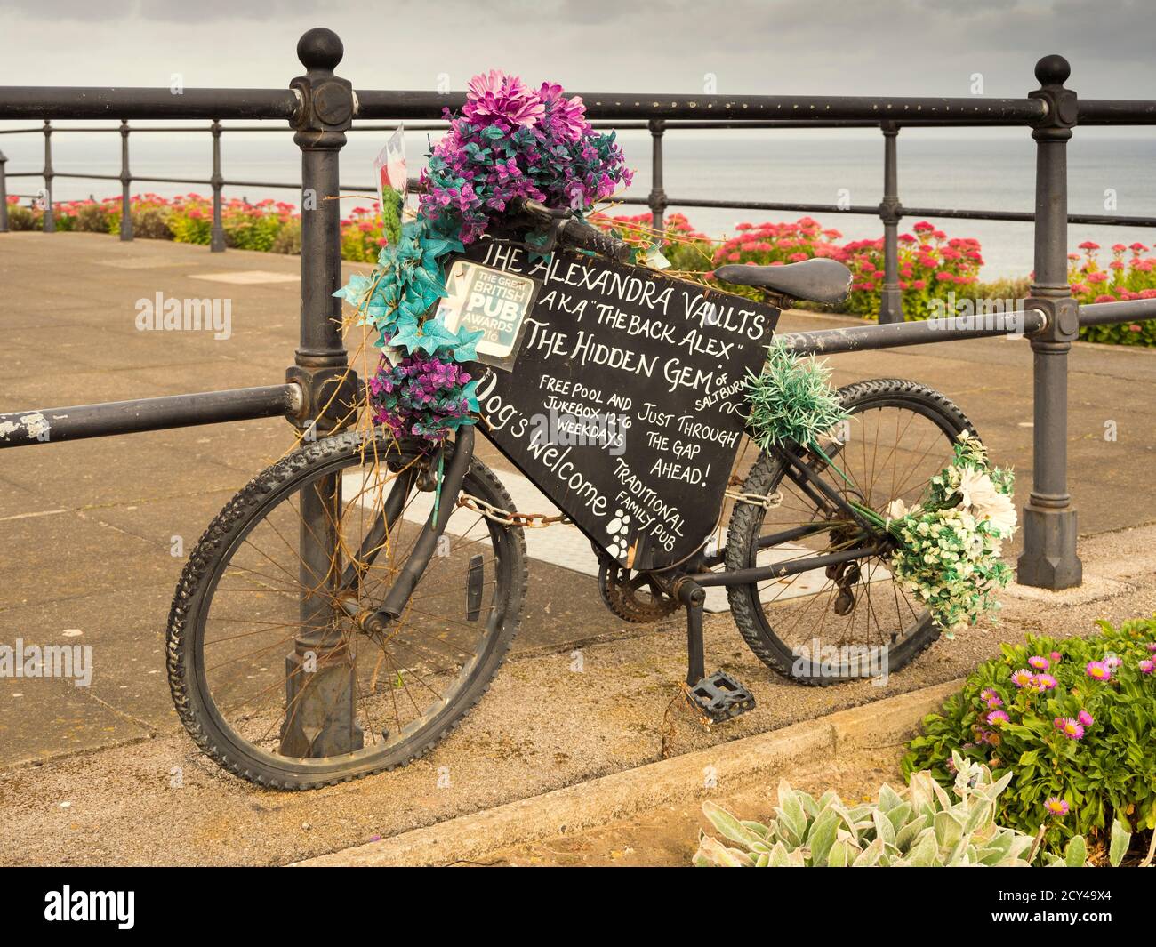 Bicycle recycled as advertising hording in Marine Parade, Saltburn Stock Photo