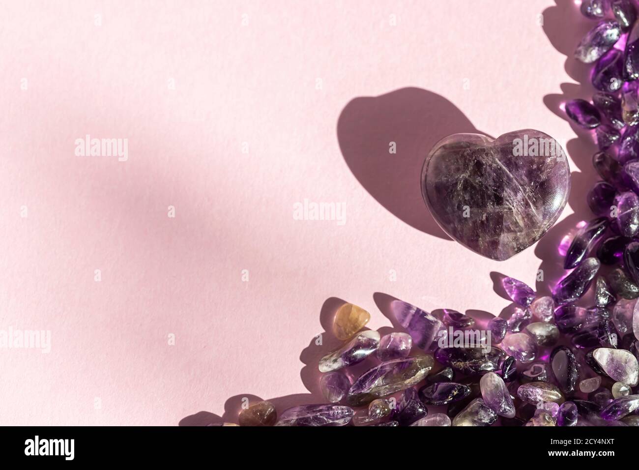 Crystal minerals for meditation on pink background. Magic Rock for ...
