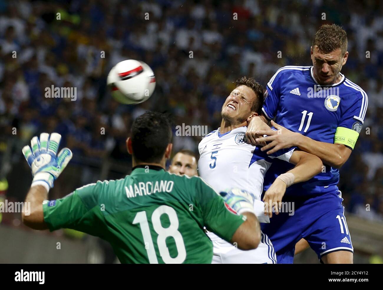 Bosnia S Edin Dzeko R Fights For The Ball Against Israel S Rami Gerhson C And Ofir Marciano