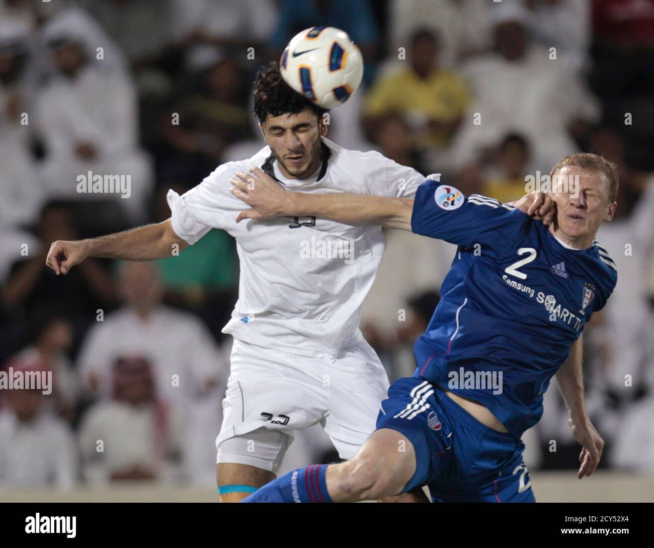 Ibrahim Majed of Qatar's Al-Sadd fights for the ball with Mato Neretljak  (R) of South Korea's Suwon Samsung Bluewings during their AFC Champions  League semi-final match in Doha October 26, 2011. REUTERS/Fadi