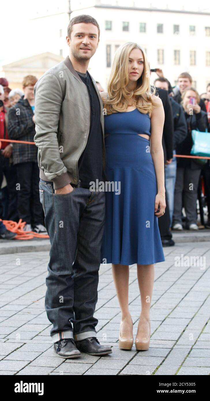 Cast members Justin Timberlake and Amanda Seyfried pose for photographers  next to the Brandenburger Tor gate to promote their latest movie "In Time"  in Berlin November 2, 2011. The film opens in