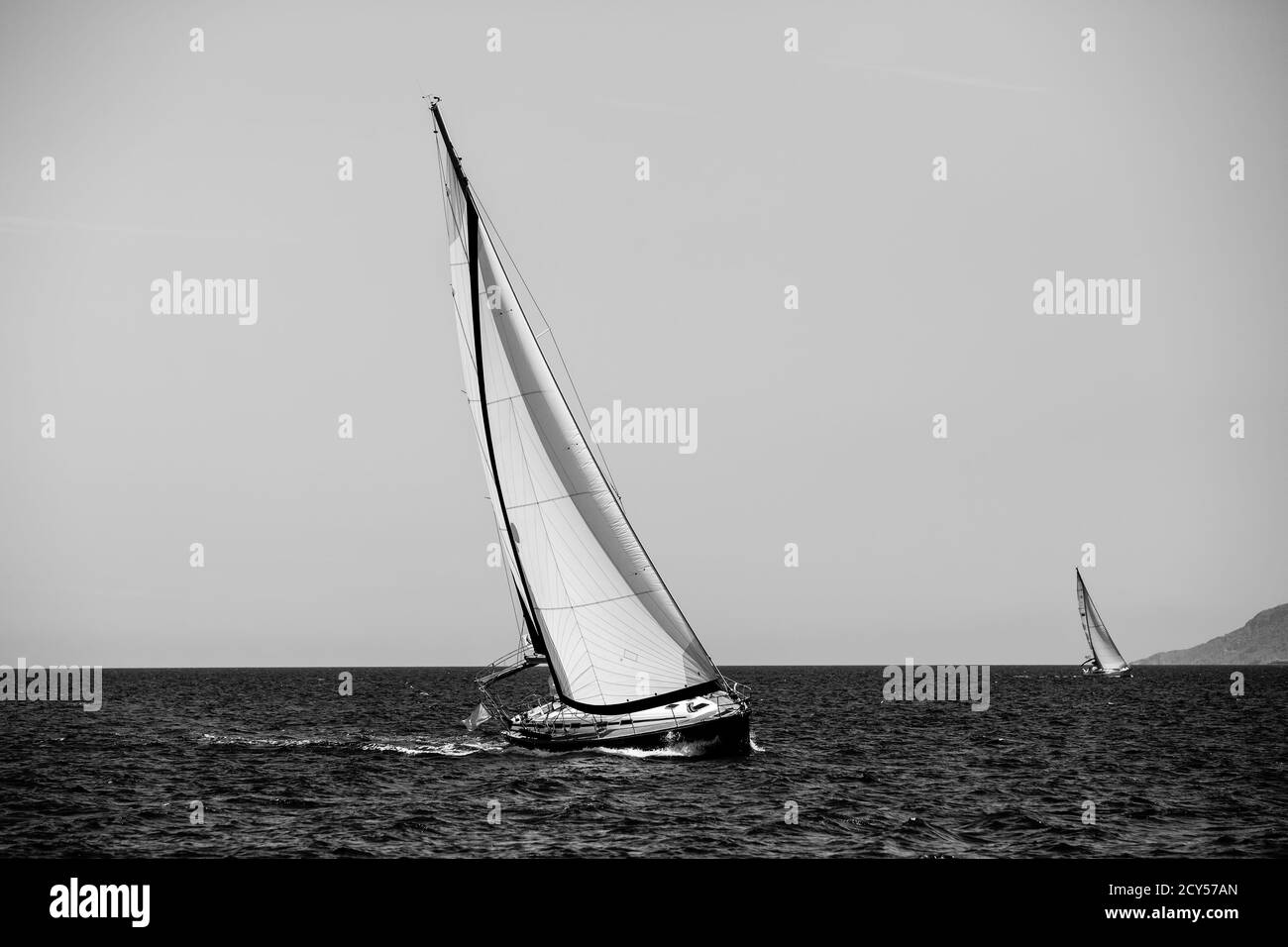 Luxury sailing. Sailboat in the regatta in the Aegean Sea. Black and white photography. Stock Photo