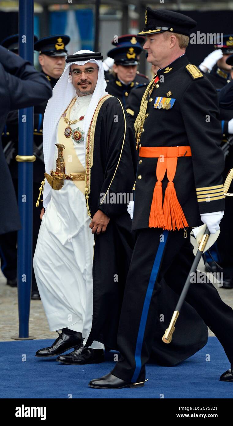 Crown Prince Salman bin Hamad al Khalifa of Bahrain (L) leaves Nieuwe Kerk church after the religious crowning ceremony of Dutch King Willem-Alexander in Amsterdam April 30, 2013. Queen Beatrix of the Netherlands abdicated on Tuesday, handing over to her eldest son, Willem-Alexander, who became the first King of the Netherlands in over 120 years. REUTERS/Dylan Martinez (NETHERLANDS  - Tags: POLITICS ENTERTAINMENT ROYALS) Stock Photo