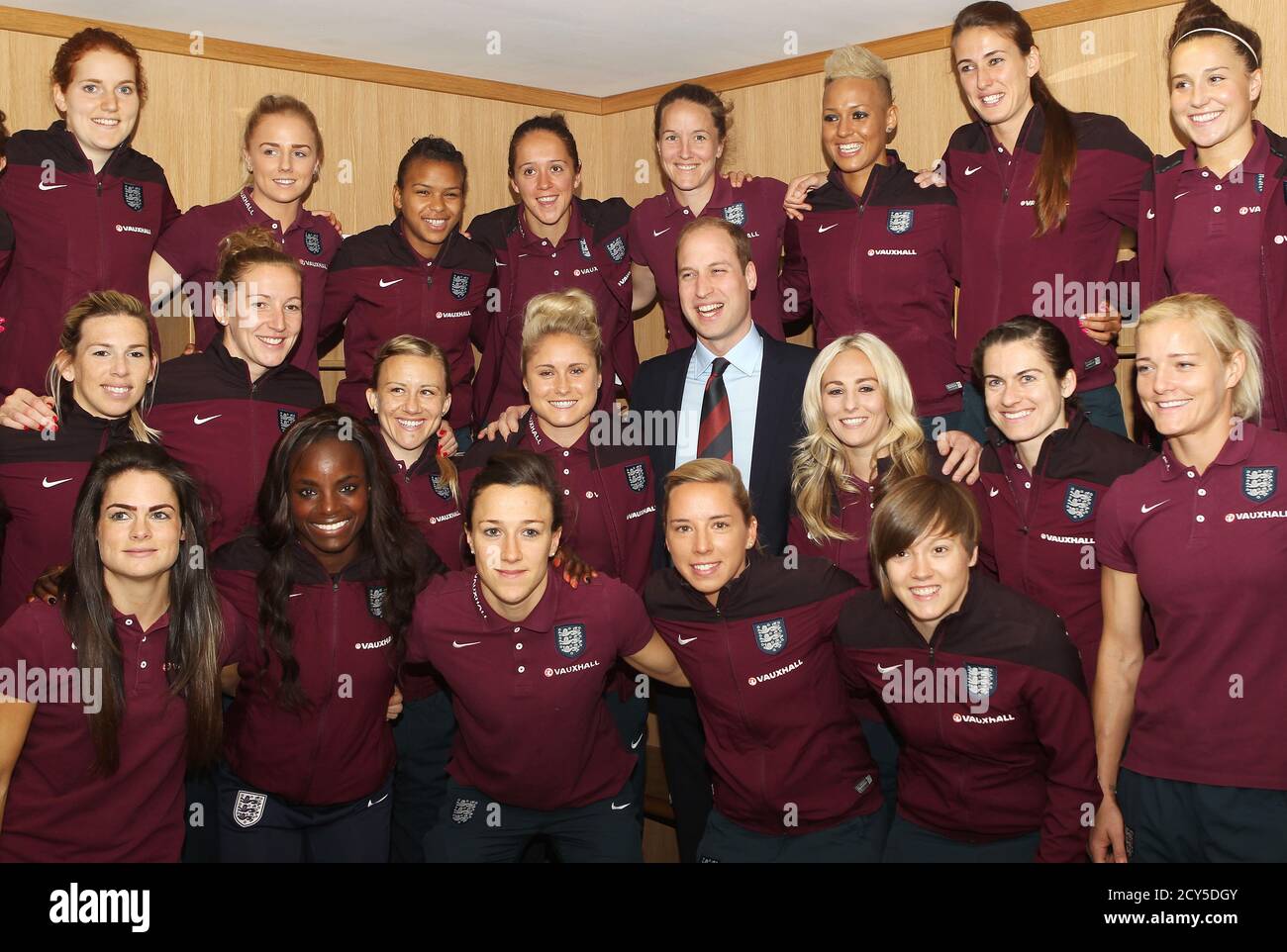 Britain's Prince William poses for a team photo with the England ladies soccer World Cup squad at St George's Park, Burton, Britain, May 20, 2015.  REUTERS/Bradley Ormesher/Pool Stock Photo