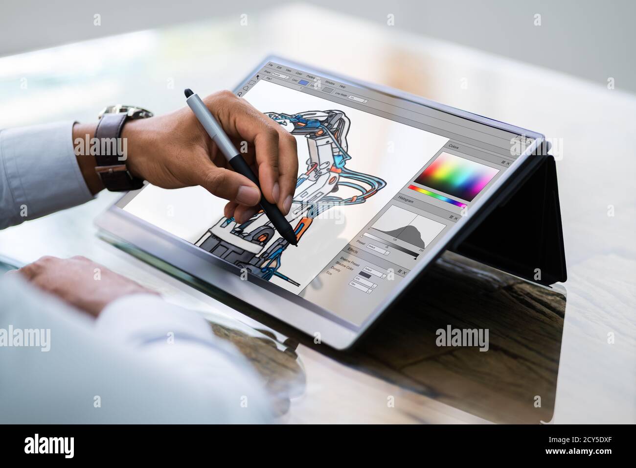 African American Designer Using Tablet  Computer In Office Stock Photo