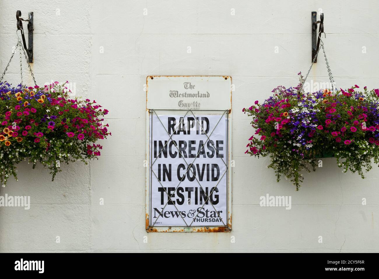 Rapid Increase in Covid Testing headline, News and Star Newspaper advertising poster, Shap, Lake District, Cumbria, England, UK Stock Photo