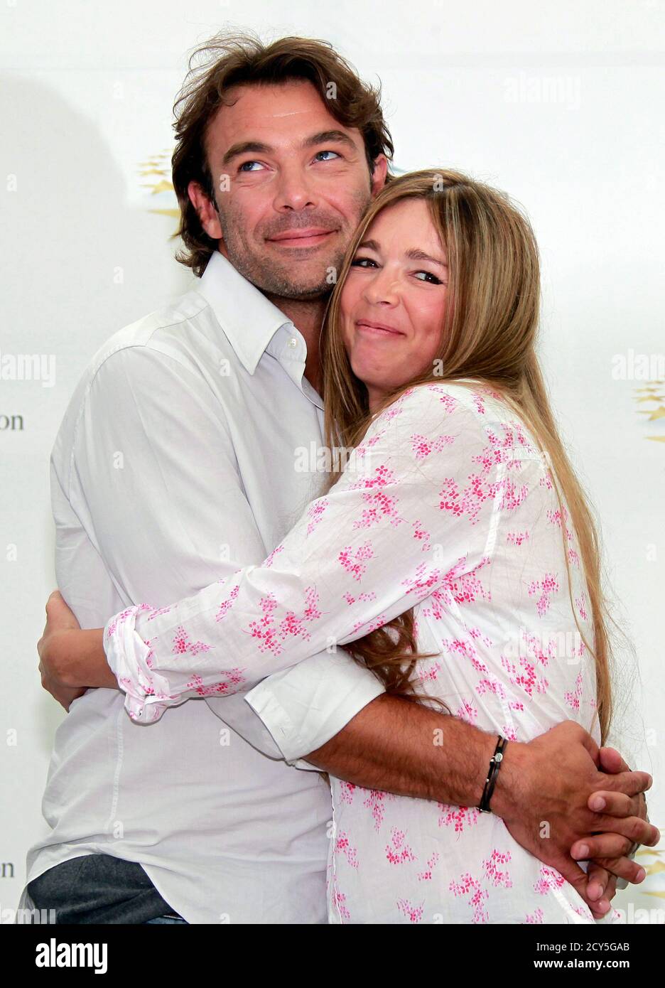 Actors Patrick Puydebat and Helene Rolles who star in the television series  'Les Mysteres De L'amour' pose during a photocall at the 51st Monte Carlo  television festival in Monaco June 9, 2011.