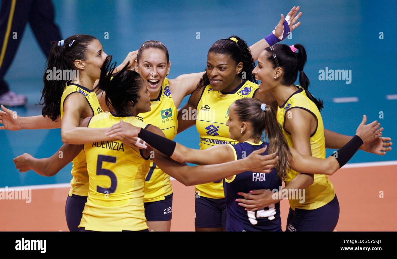 Brazil's volleyball team celebrates a point against Peru during their South  America women's 2012 pre-Olympic volleyball finals in Sao Carlos May 13,  2012. Brazil won 3-0 and is qualified to participate in