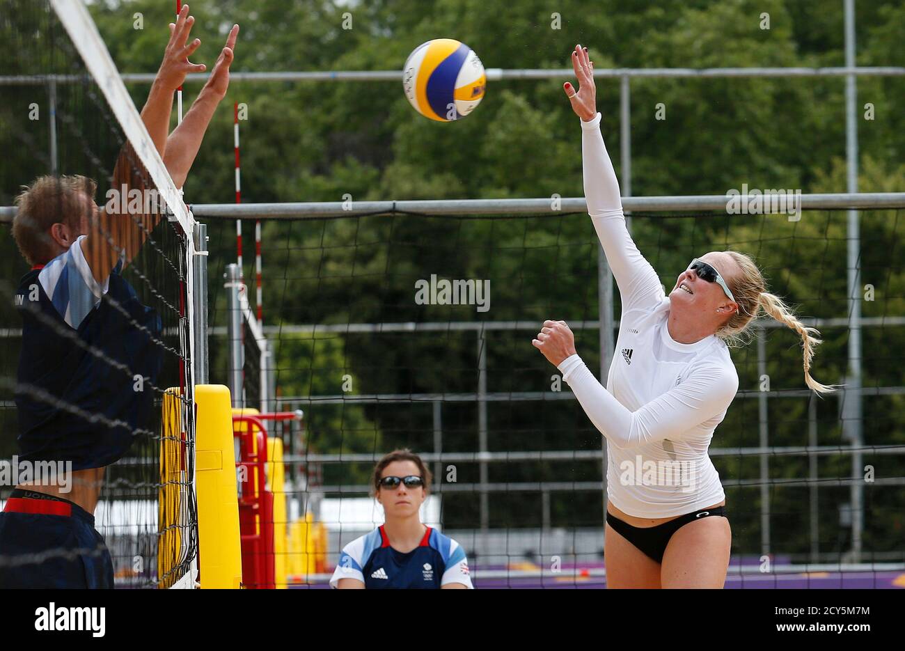 Britain's beach volleyball player Shauna Mullin (R) trains at the London 2012 Olympics beach volleyball venue in central London July 19, 2012. REUTERS/Suzanne Plunkett (BRITAIN - Tags: SPORT OLYMPICS SOCIETY VOLLEYBALL) Stock Photo