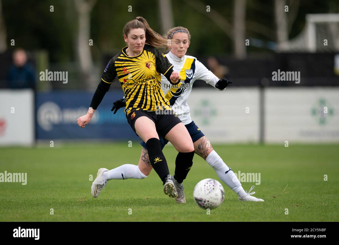 Kat Huggins of Watford Women & Molly Peters (37) of Oxford United Women during the FA Women National League match between Watford Women and Oxford Uni Stock Photo
