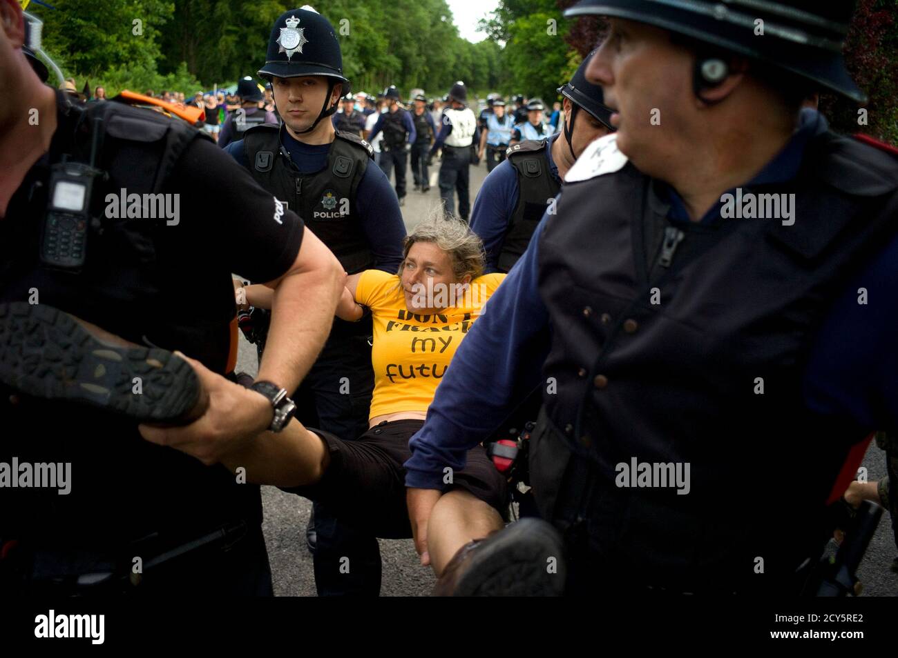 A Local Demonstrator Is Carried Away After Attempting To Prevent Police  Officers From Escorting A Lorry Carrying Office Furniture To An Oil  Drilling Site Run By Cuadrilla Resources Outside The Village Of