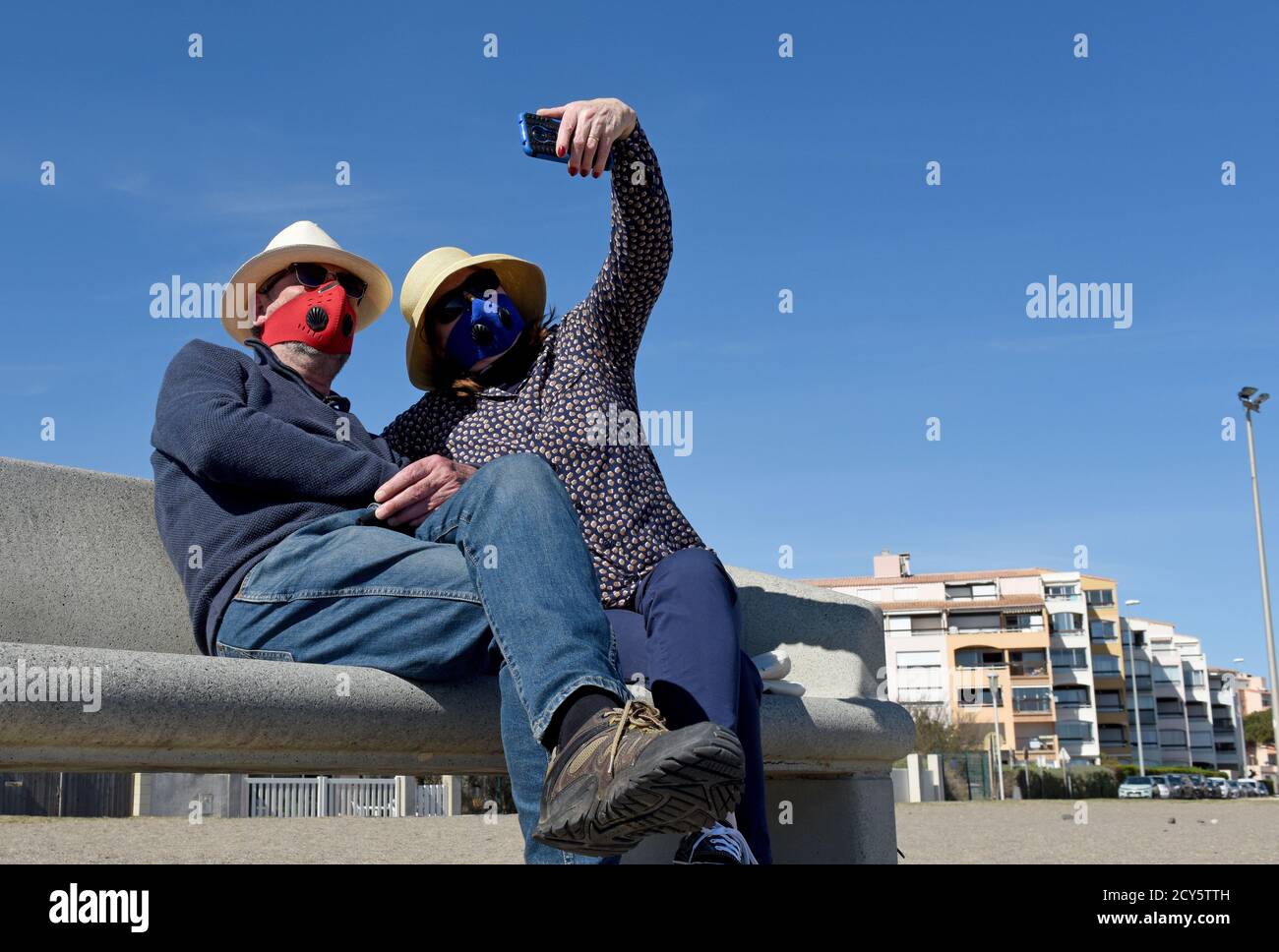 Couple on holiday wearing face masks in southern France during Covid-19 virus pandemic in 2020. coronavirus facemask Stock Photo
